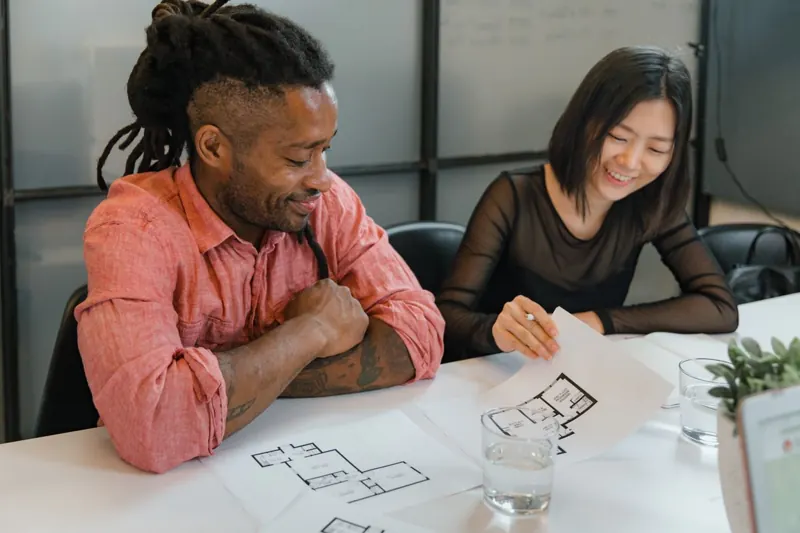 Sample design team collaborating on architectural plans